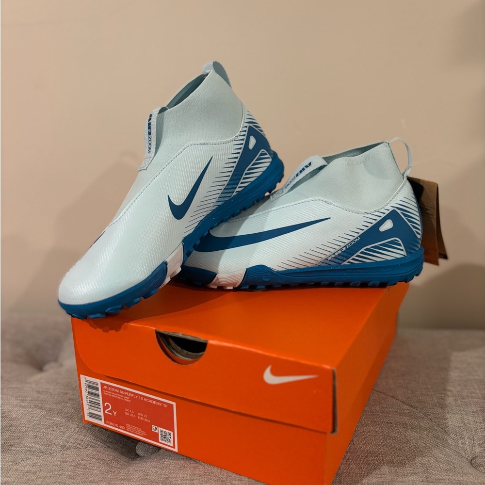 Nike Kids outdoor soccer cleats in Light Blue and Dark Blue